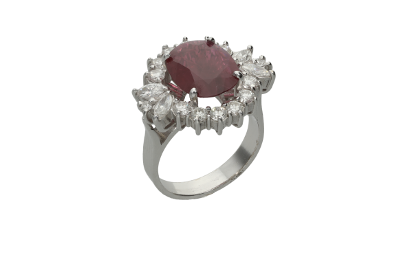 Δαχτυλίδι ροζέτα σε λευκόχρυσο 18Κ χειροποίητη με ένα οβάλ ρουμπίνι που συνοδεύετε από και διαμάντια σε κοπή μπριγιάν και ναβέτες